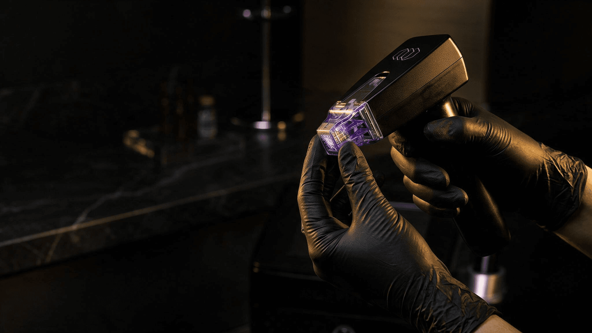 Gloved hands holding the Morpheus8 handpiece with its microneedling tip lit